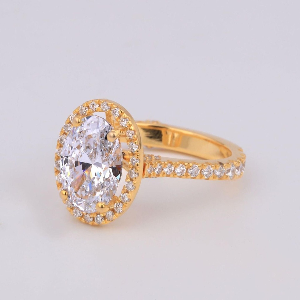 Halo set oval cut lab grown diamond solitaire ring in 14 kt yellow gold vvs clarity diamonds